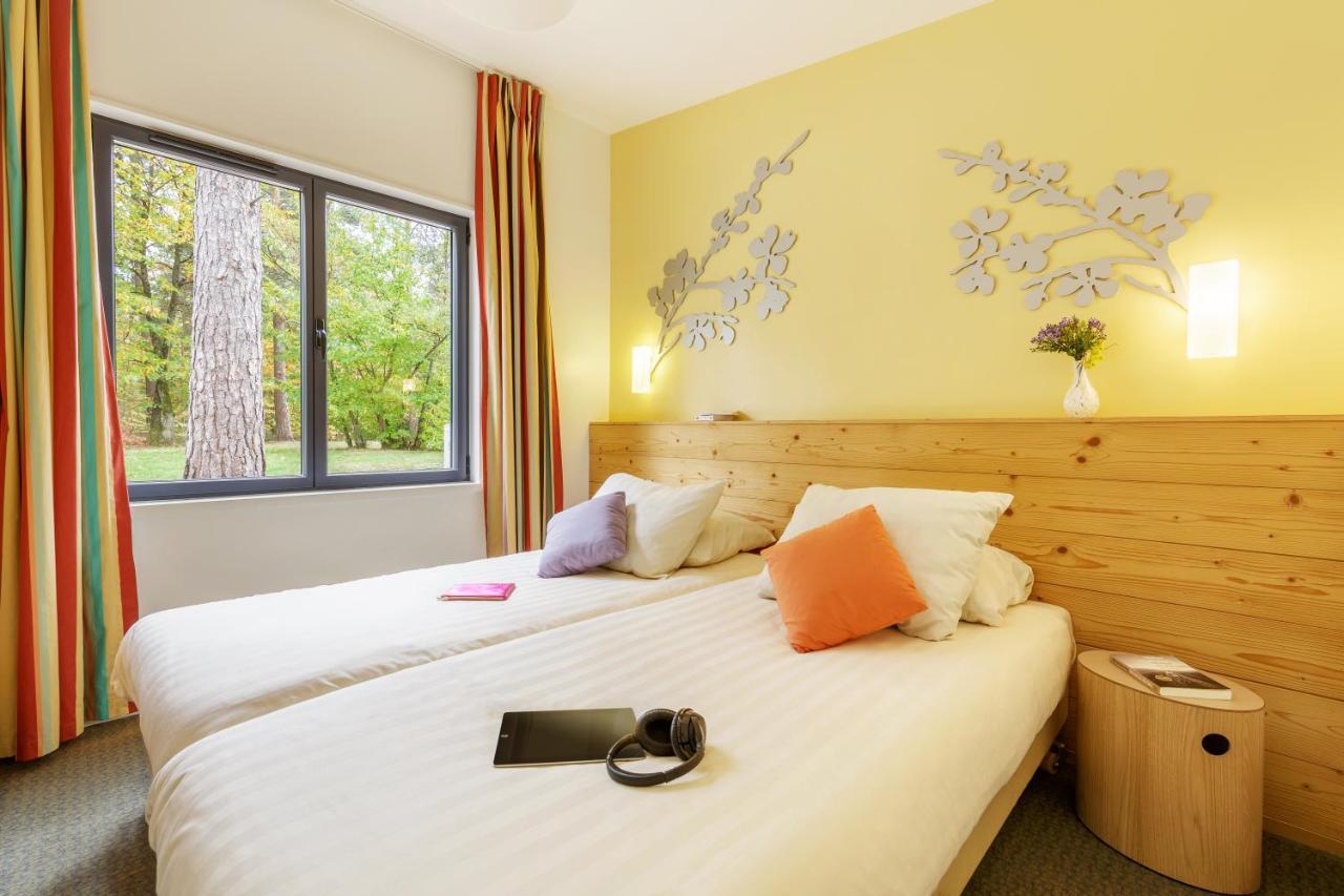 Center Parcs Les Hauts De Bruyeres Шомон-сюр-Тарон Экстерьер фото